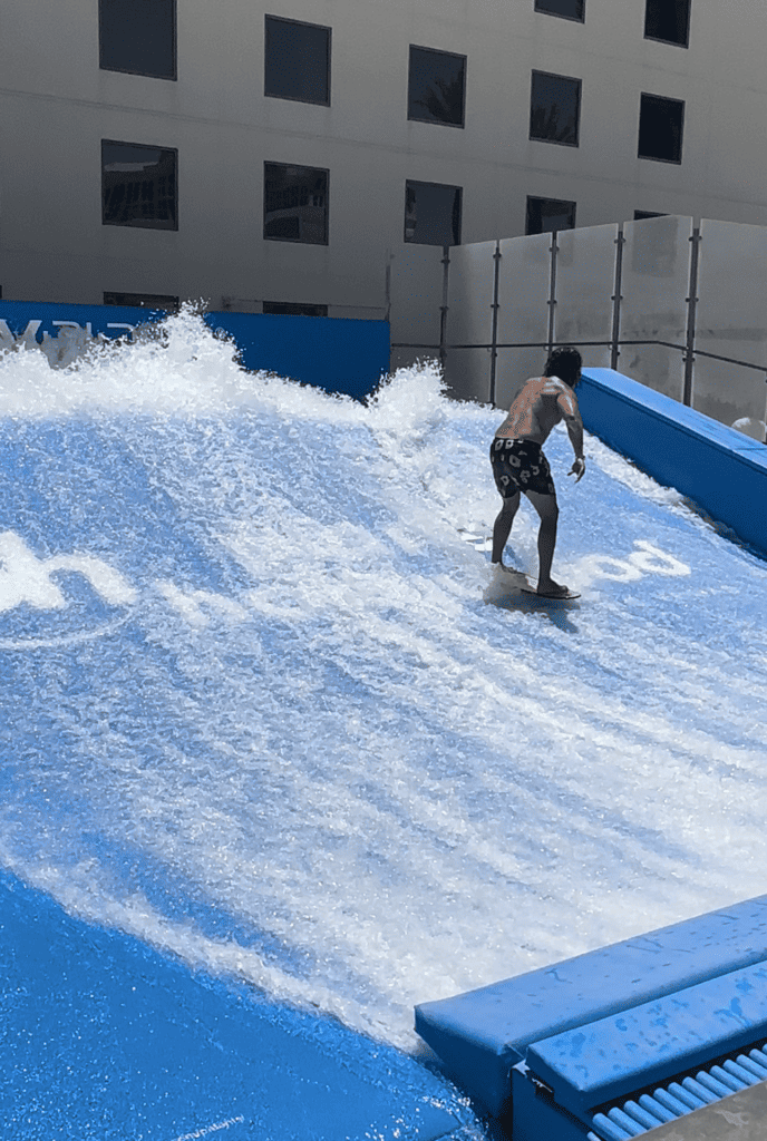 A man riding a wave on the FlowRider.