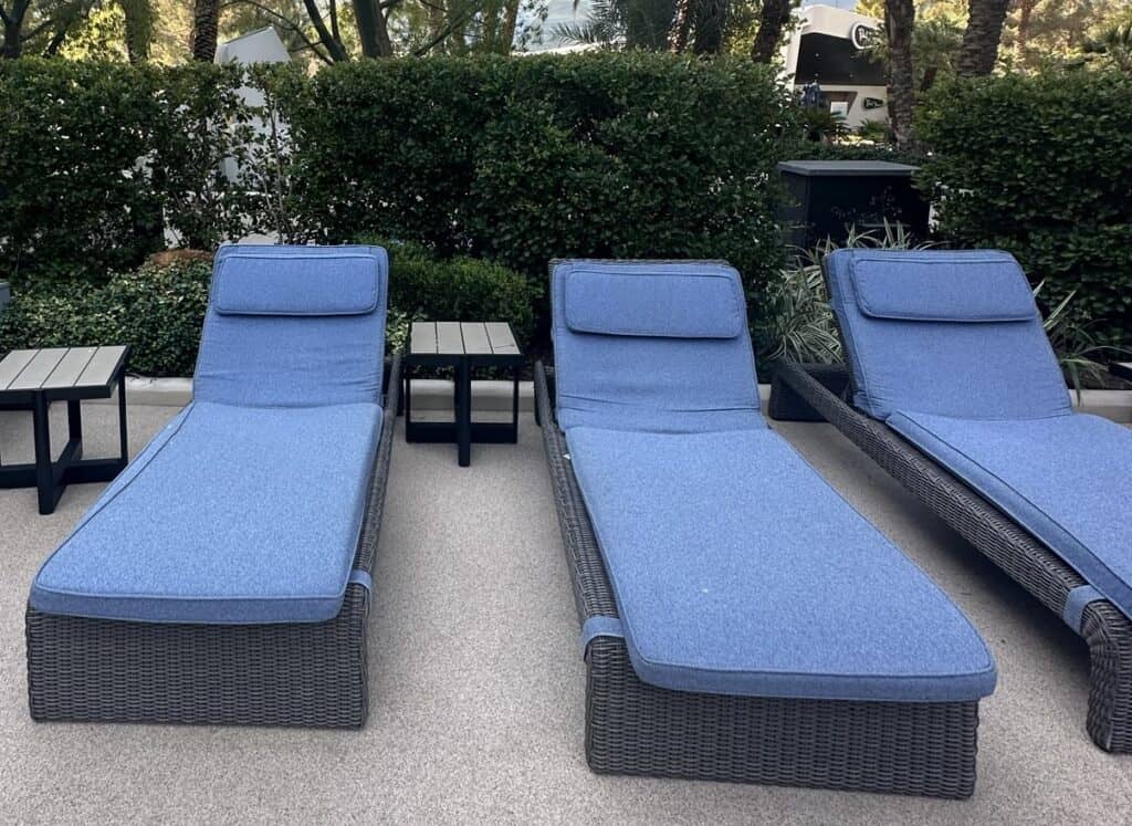 Blue reserved loungers with a side table.