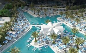 Rendering of Fontainebleau Las Vegas main pool. Multiple pools surround a centerpiece where food and entertainment will be found.
