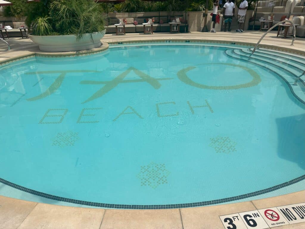 Close up pic of Tao Beach Pool.  Tao Beach is written in big letters at the bottom of the pool.