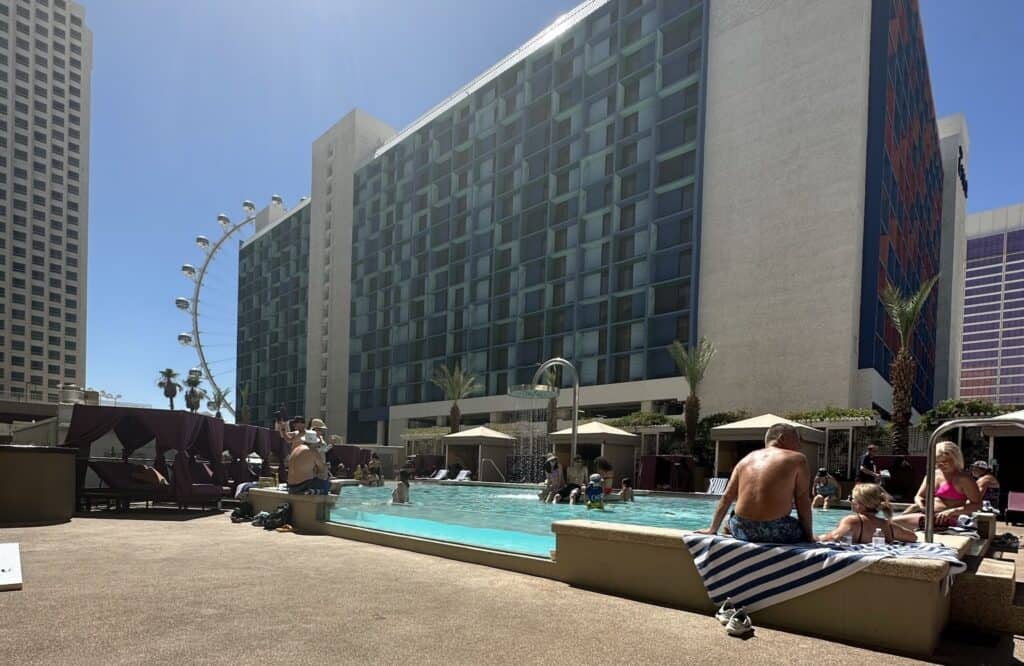 Shallow pool with see-thru ledge. The Linq hotel and High Roller can be seen in the background.