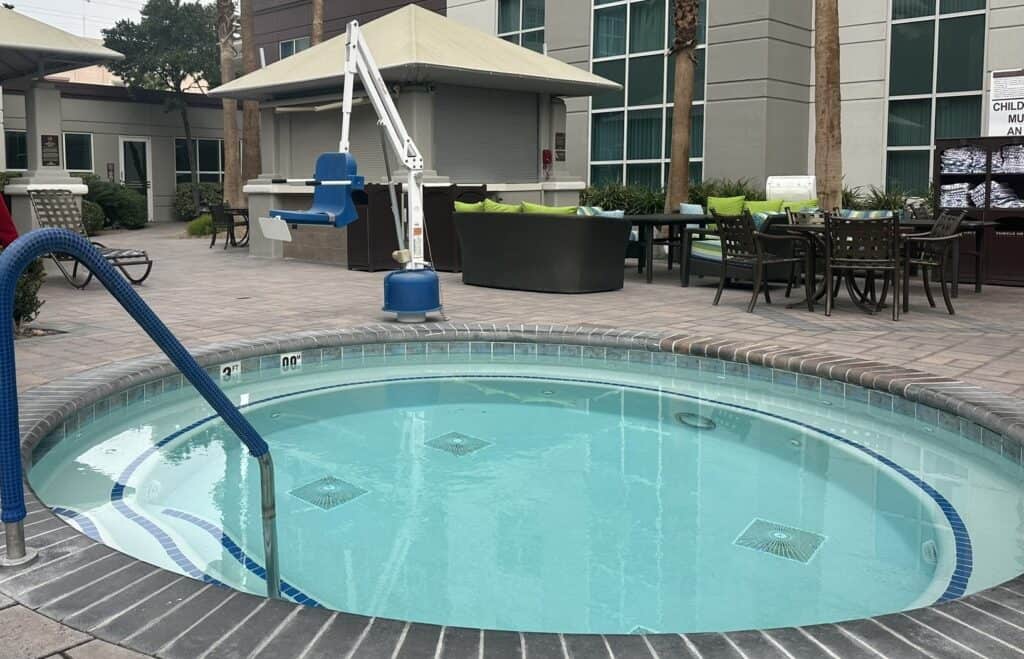 Outdoor hot tub with mobility lift.