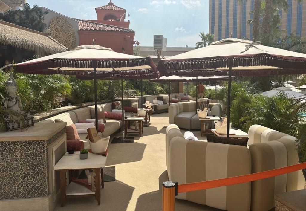 Comfortable seating area with large sun umbrellas.