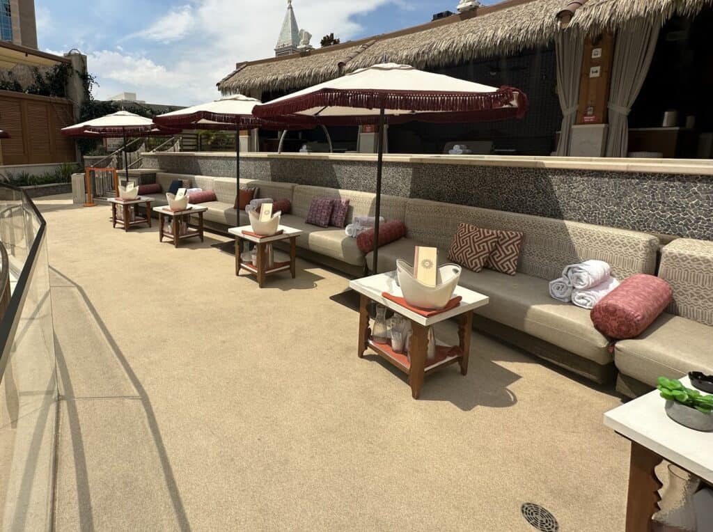 Couch seating with sun umbrellas are ready for guests.